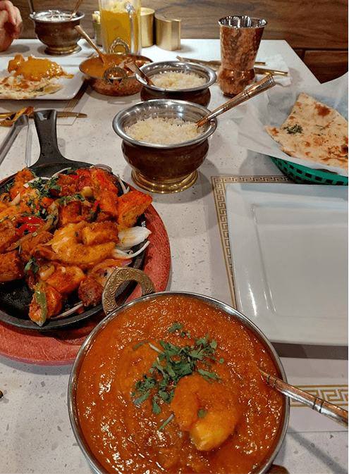 Delicious Indian food spread with naan and curry